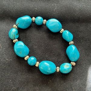 Excellent condition  Faux Turquoise stretch bracelet.